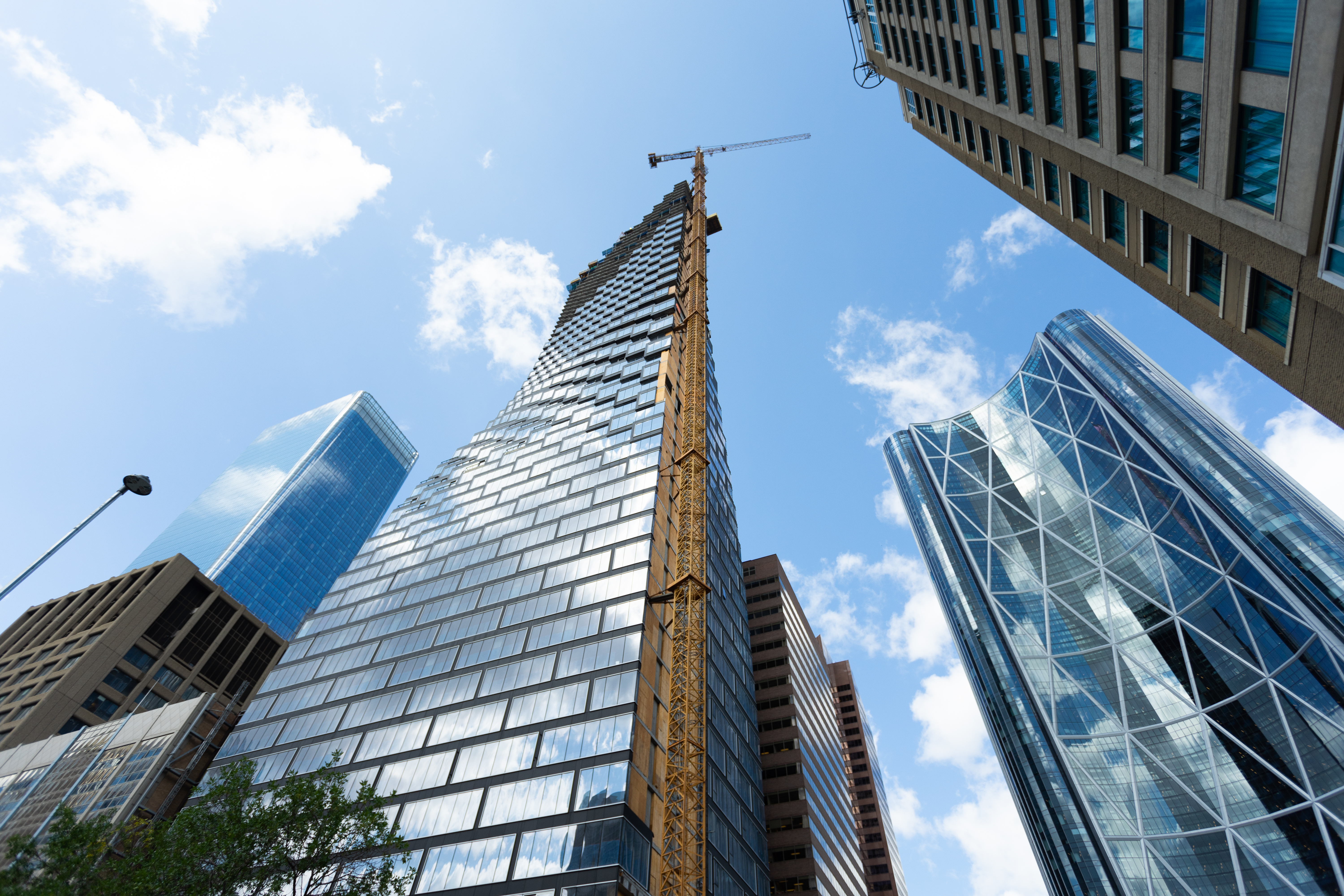 City skyscrapers viewed from below against a blue sky