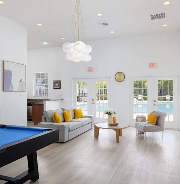 Pet-Friendly Townhomes in Kissimmee, FL – clubhouse with seating area and billiards
