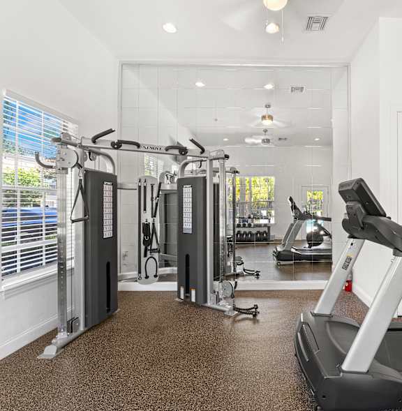 Kissimmee, FL Townhomes for Rent - A spacious gym with treadmills, elliptical machines, and other exercise equipment.