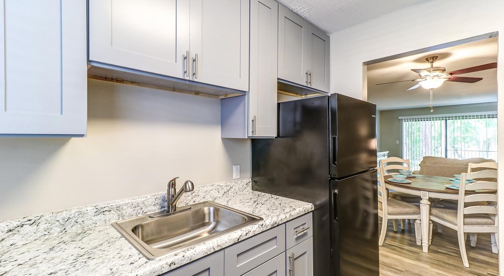 a kitchen with light cabinets