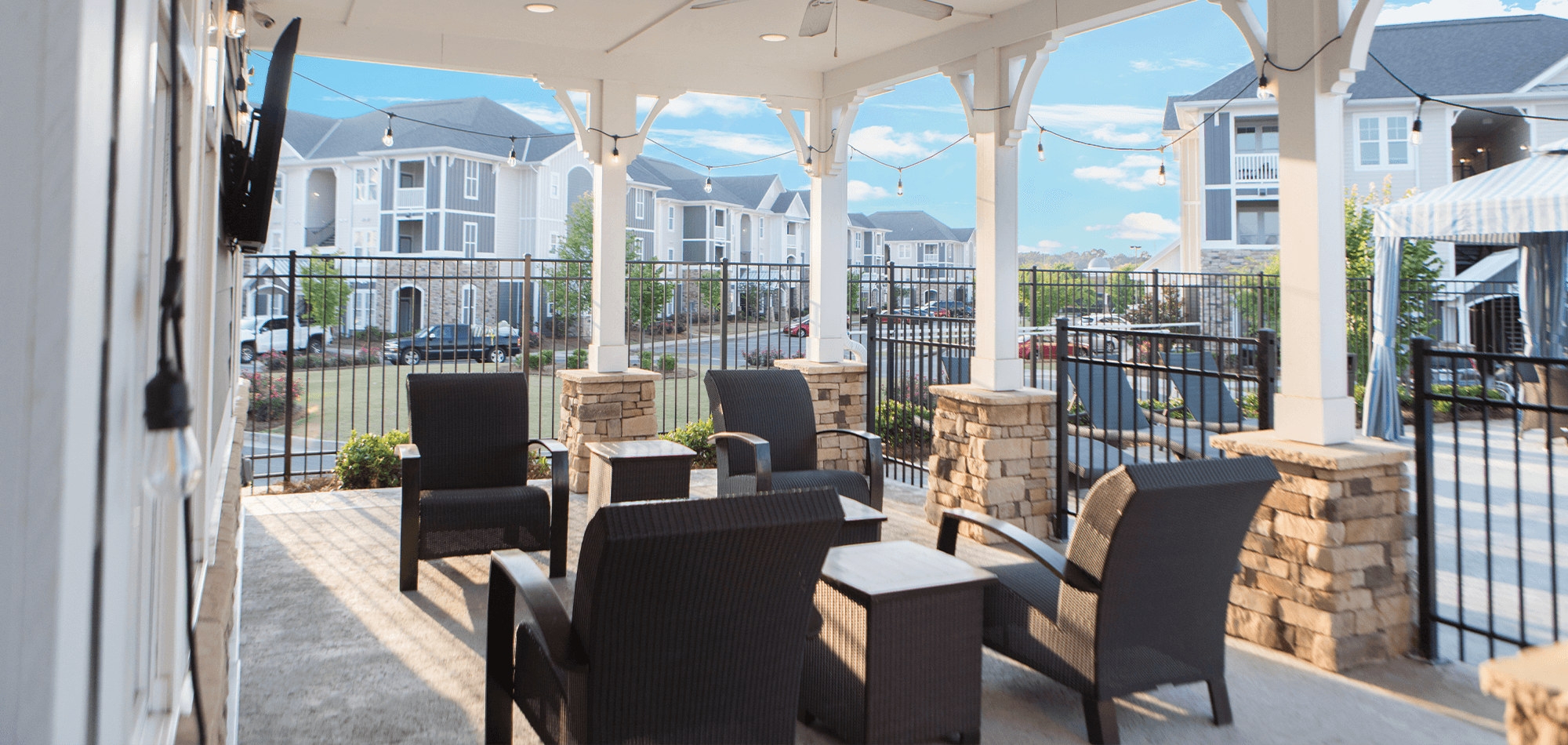 courtyard view at the Clubhouse at the Morgan at Eastchase with hanging lights and comfortable seating