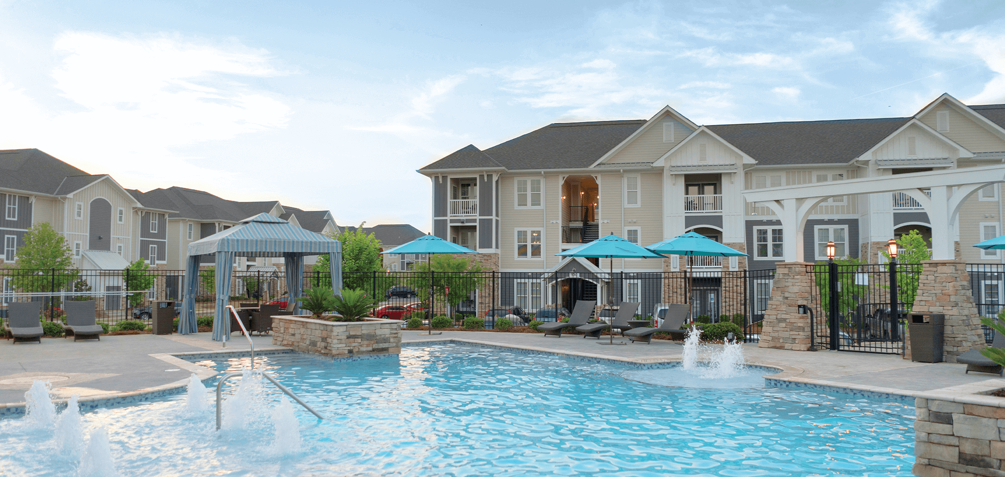 Pool view of the Morgan at Eastchase apartments with fountains and covered seating