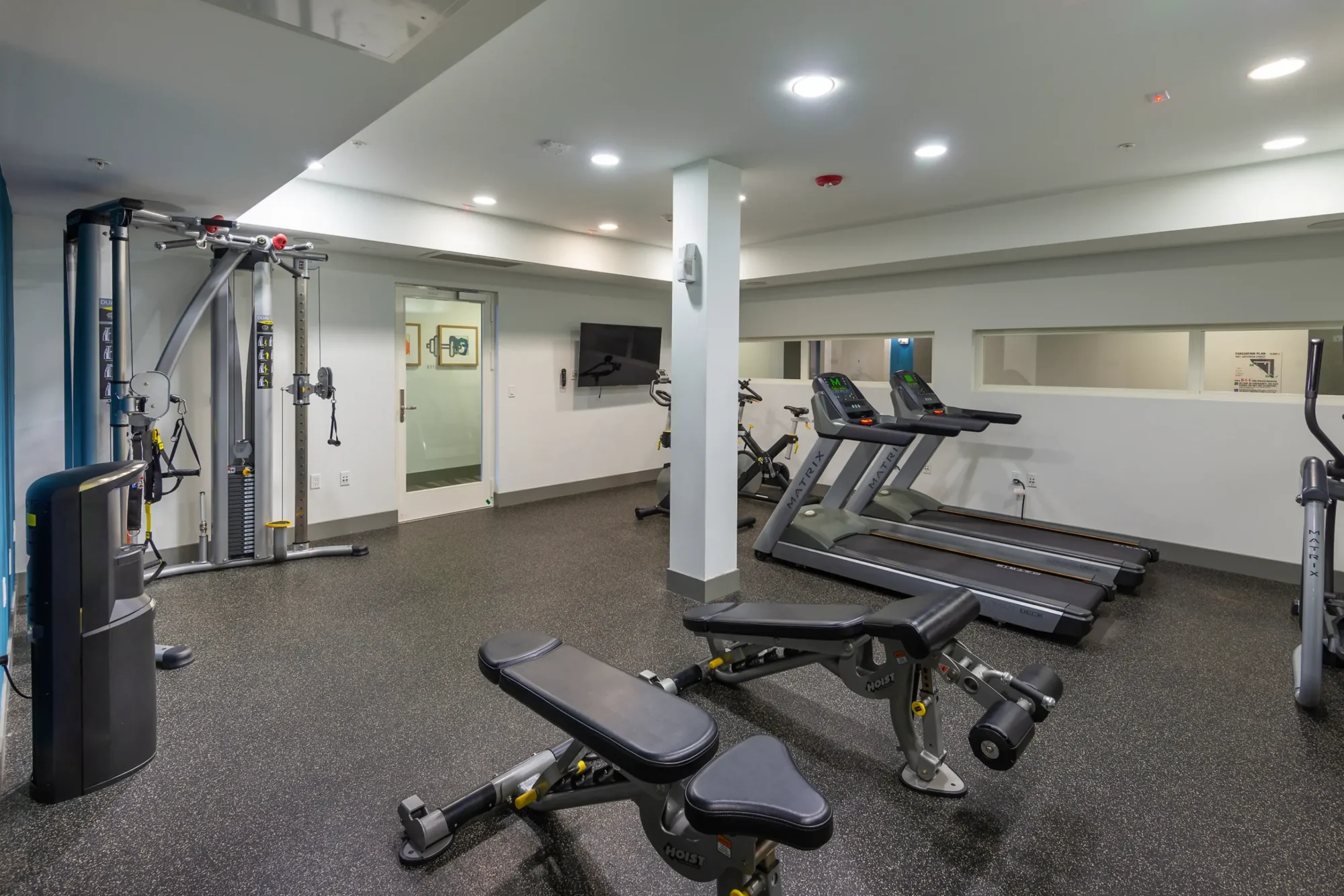 Fitness center with free weights and cardio machines