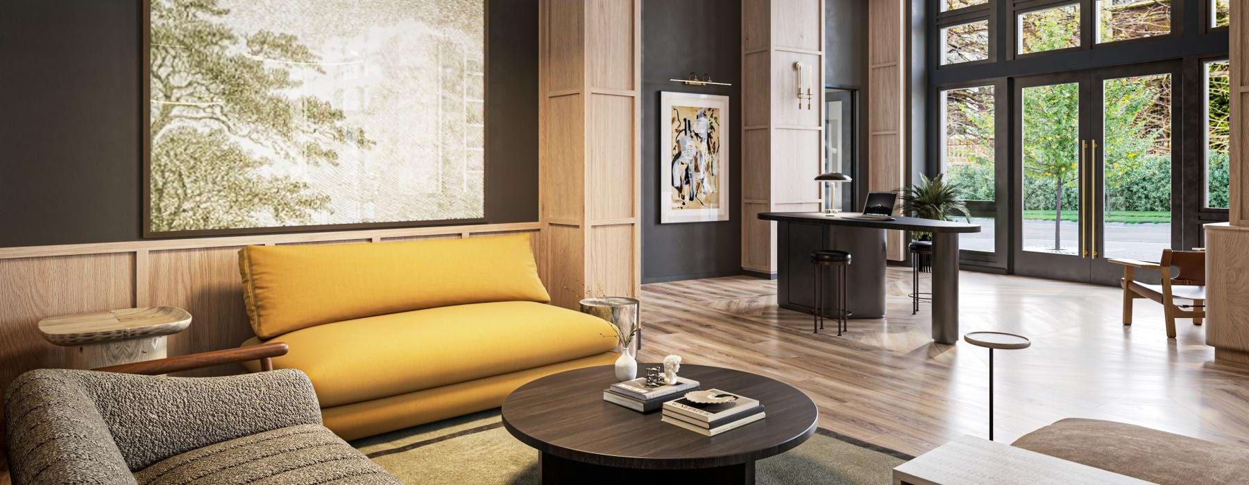 a lounge with a yellow couch and large windows