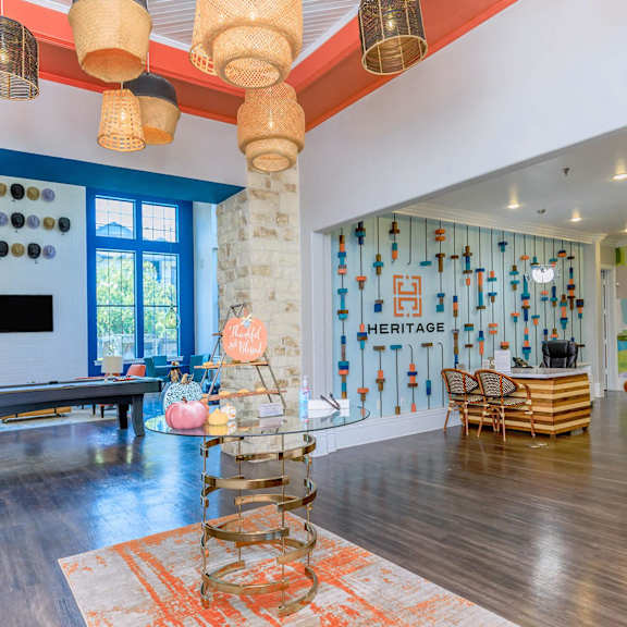 the interior of a living room with a glass table