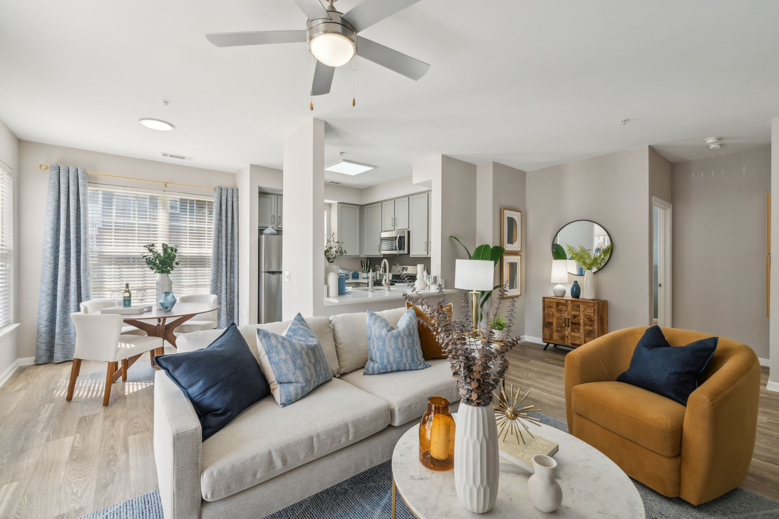 Stylish living space with cozy sofa, modern decor, and dining area.