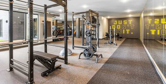 a fitness center with weights machines and other exercise equipment