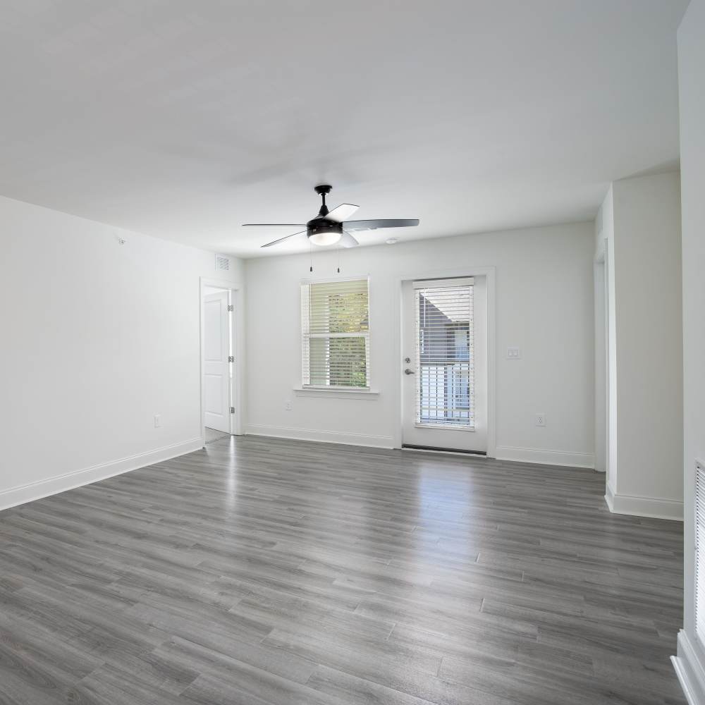 Unfurnished living room with window and door at Retreat at Redstone in Crestview, Florida