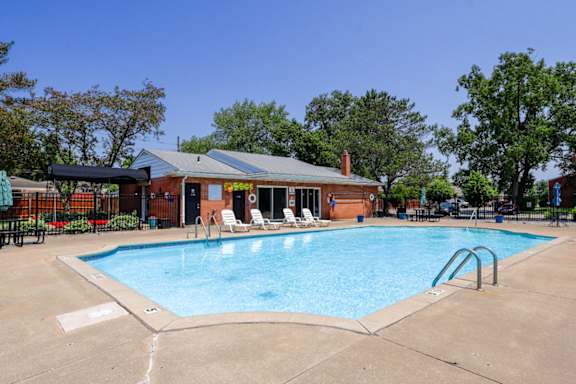 Franklin Square's sparking swimming pool with the clubhouse in the background