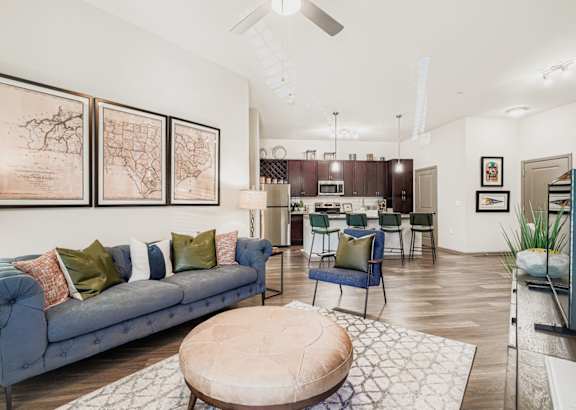 A living room with a blue couch and a coffee table.