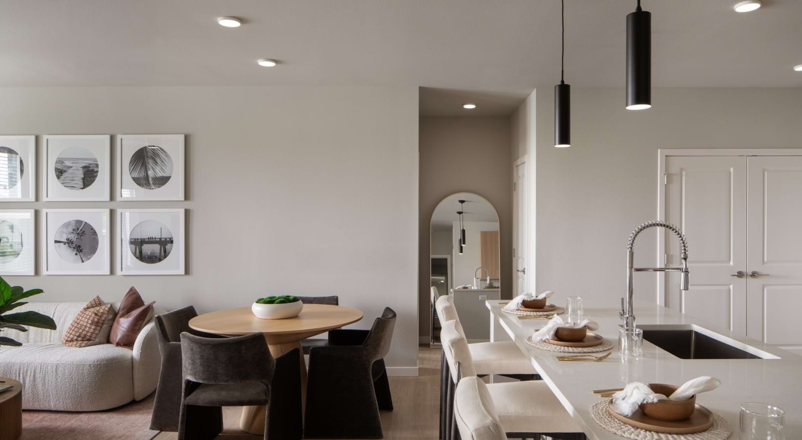 kitchen with seating open to living room with table and couch