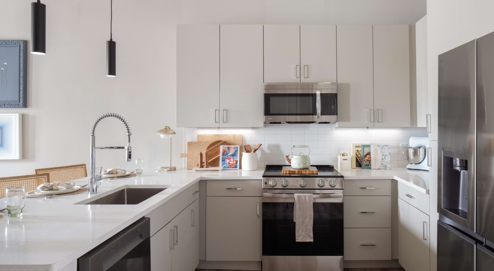 kitchen with white countertops and stainless steel appliances