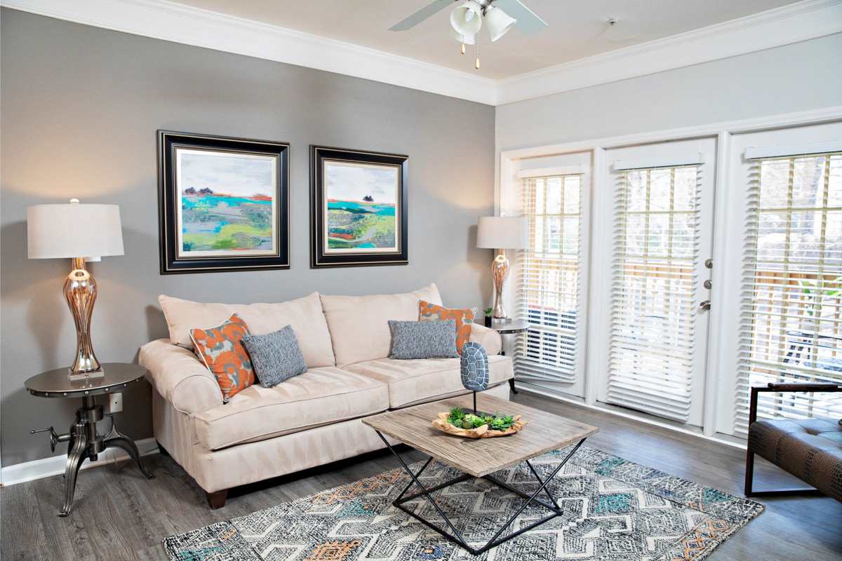 Natural-Lit Living Room with Hardwood-Style Flooring at Southpoint Estate Apartments, Durham, North Carolina