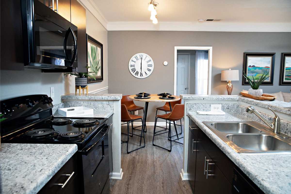 Modern Kitchen Next to Dining Area at Southpoint Estate Apartments, Durham, North Carolina