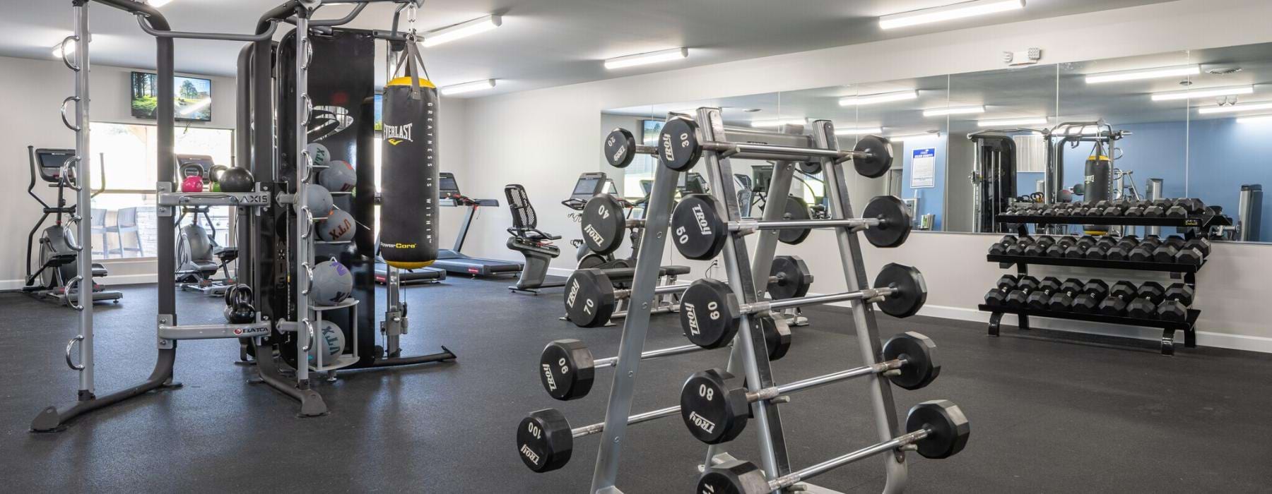 A fitness center with fitness equipment at Sugar Creek Missouri apartments for rent.