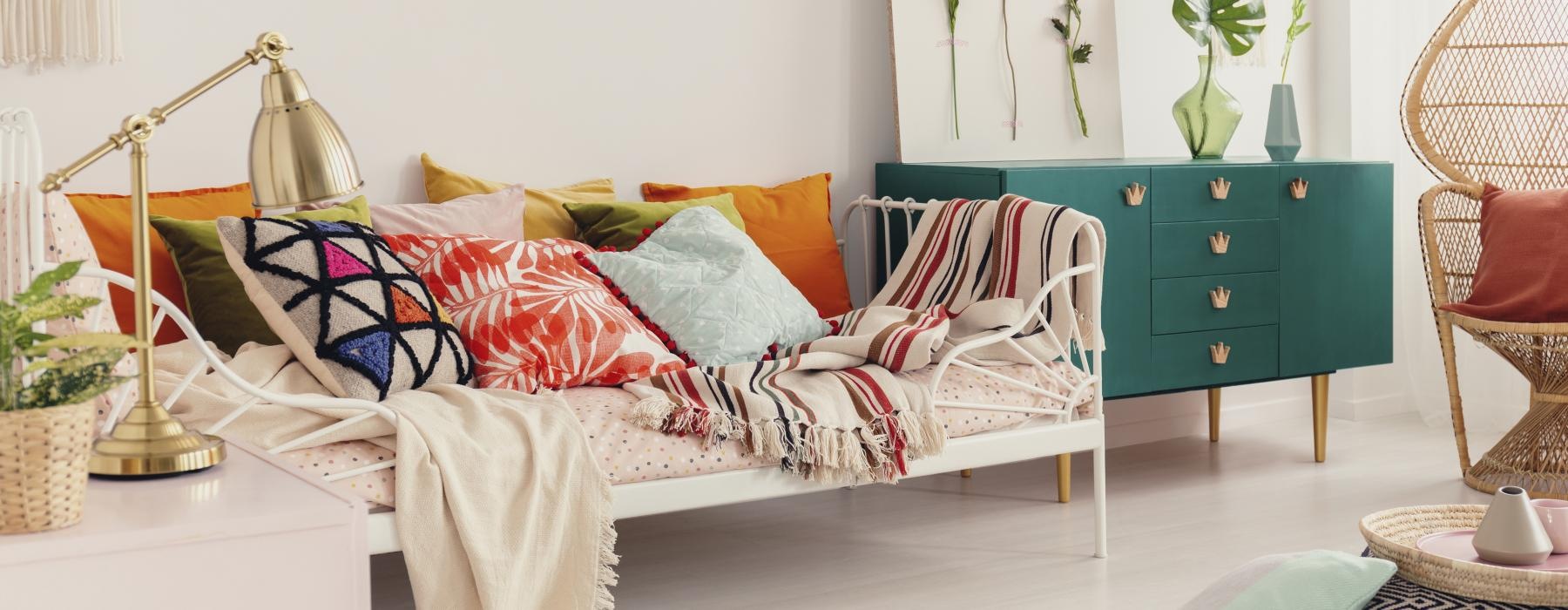 a white couch with pillows
