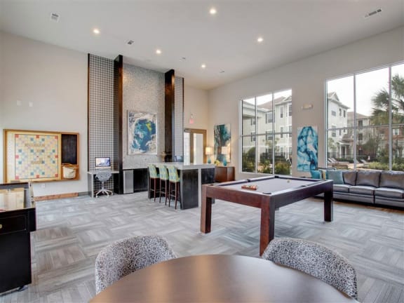 a large living room with a pool table at Volare at the Woodlands, The Woodlands, Texas