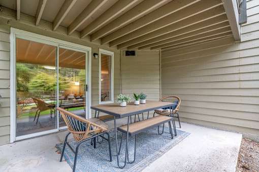 A patio with a table and chairs is shown.
