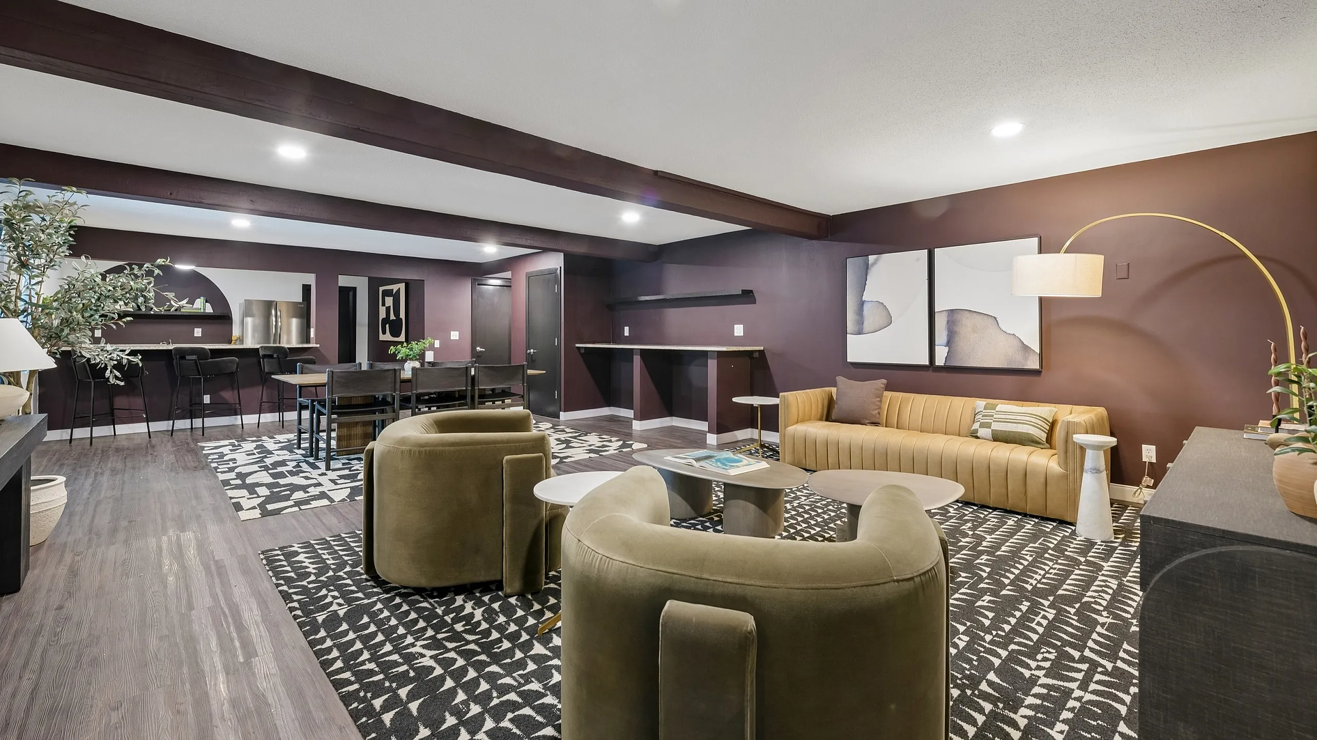 Elegant open-concept living room with plush seating, stylish decor, and a cozy, warm ambiance.