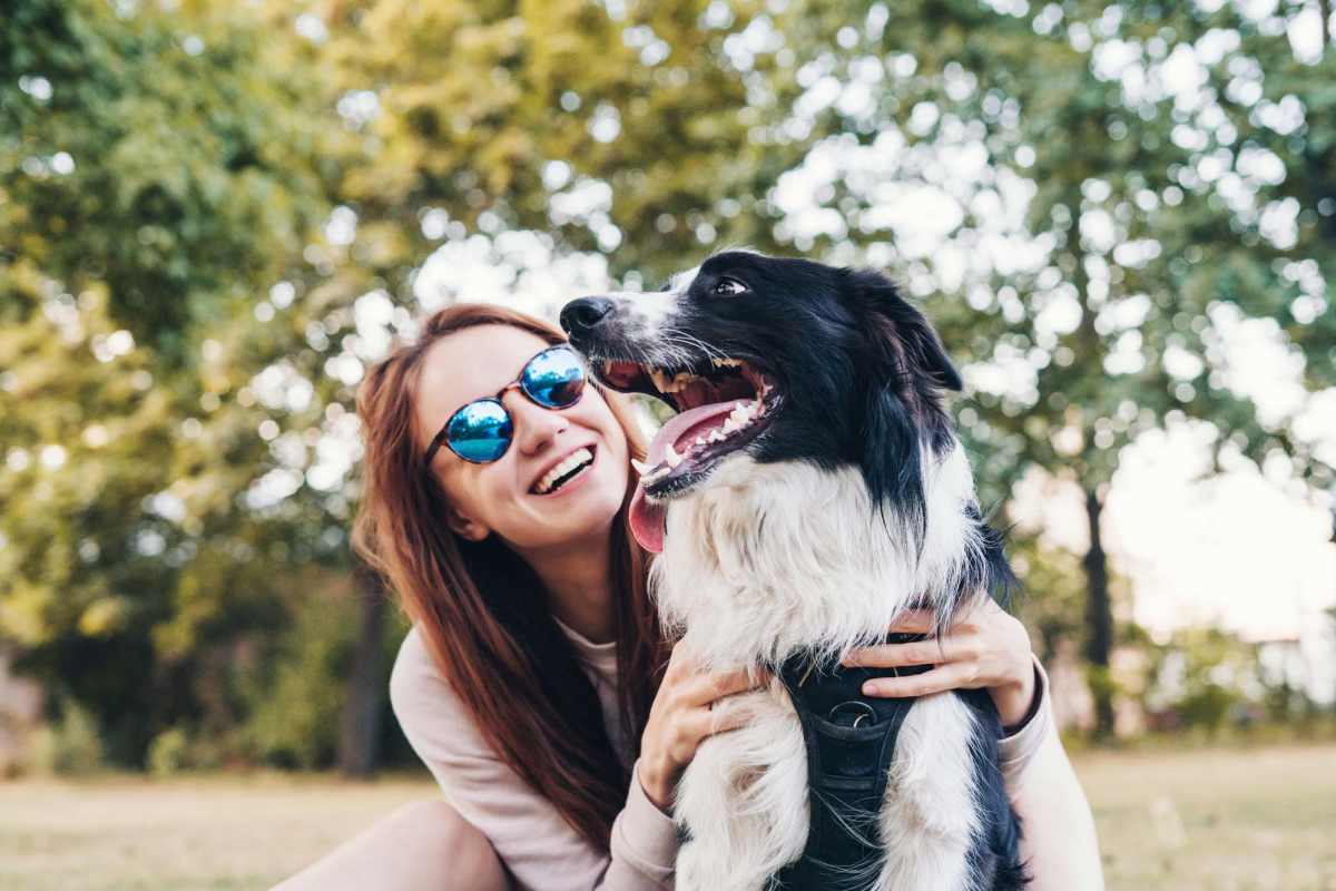 Resident playing with her pet in park near Jefferson Green in Louisville, Kentucky