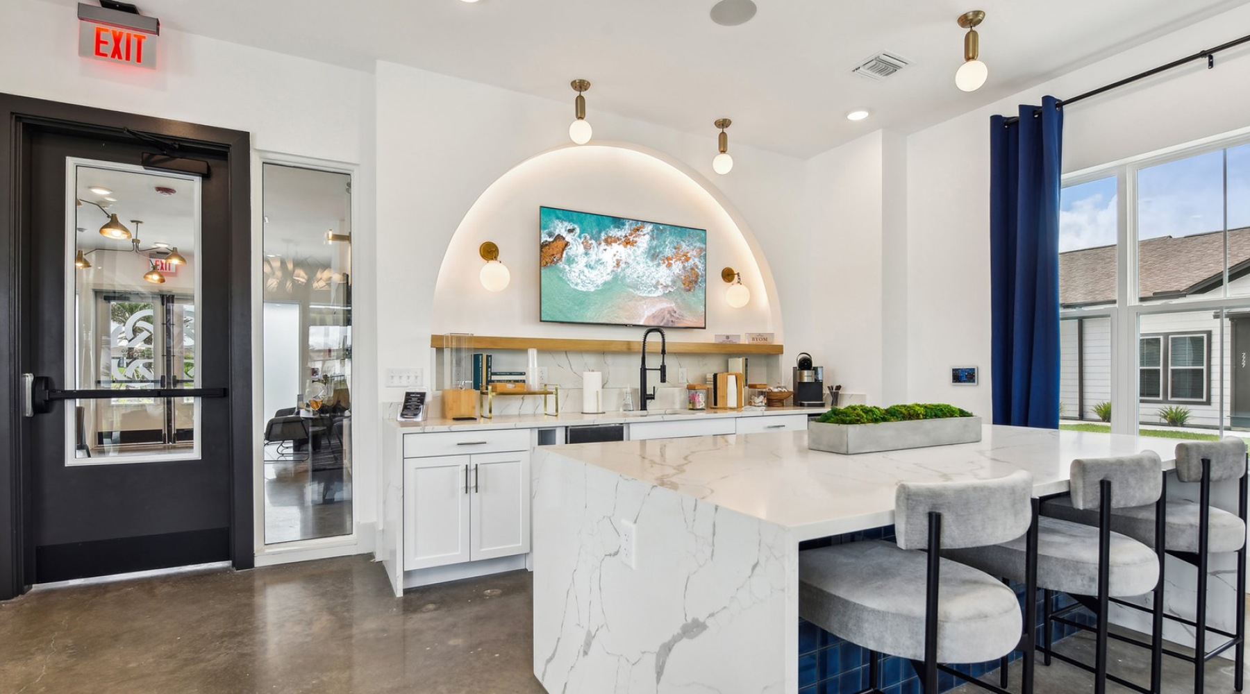 large kitchen with tv and island with seating