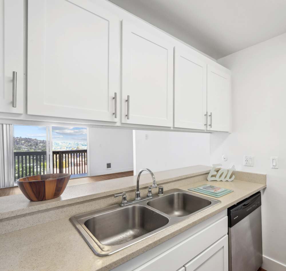 Kitchen with modern appliances at The Riley at Belmont Hills in Belmont, California