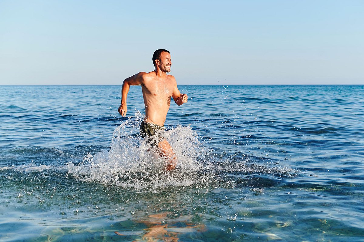man running in the beach