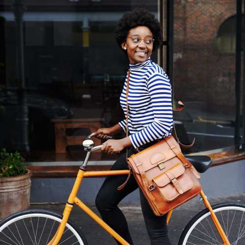 Woman biking to work near Cypress Point in Mooresville, North Carolina.