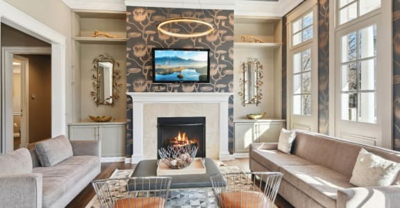 a living room with a fireplace and couches
