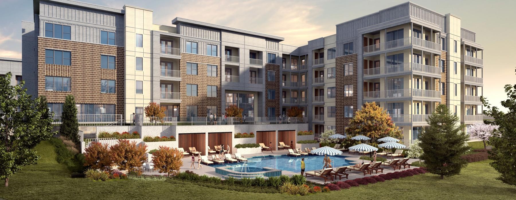 a large building with a pool in front of it