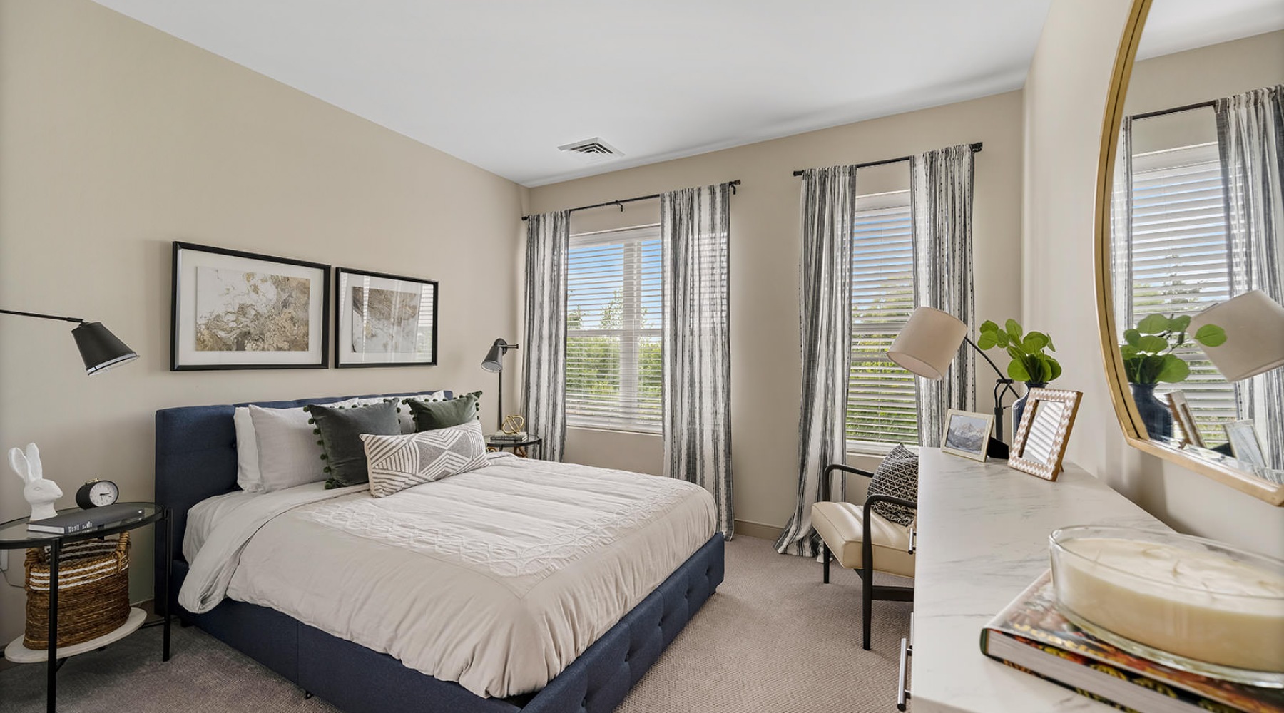 carpeted bedroom with large windows