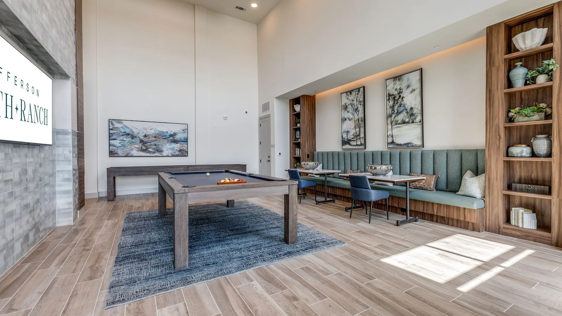 lounge area with a billiard table, seating, and artwork