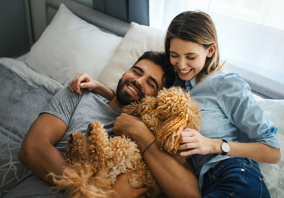 Young couple with small fluffy dog