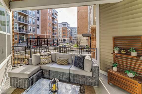 patio with a couch at Dartmoor Place at Oxford Square Apartments, Hanover, MD 21076