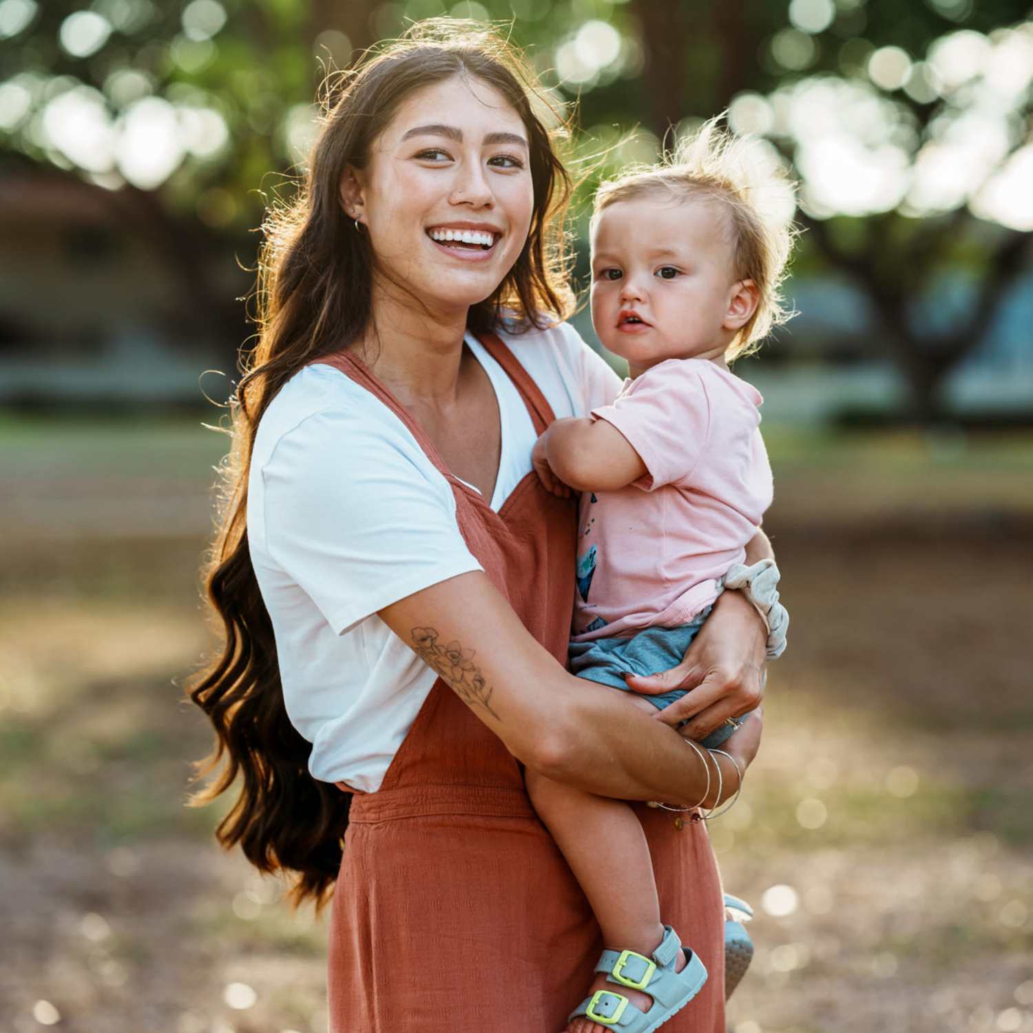 Resident with her kid in the park near Preserve at Dunwoody in Dunwoody, Georgia
