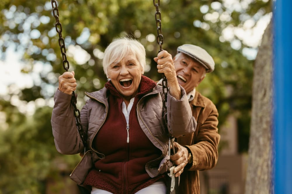 Resident swinging while being pushed near The Joyce in Durham, North Carolina