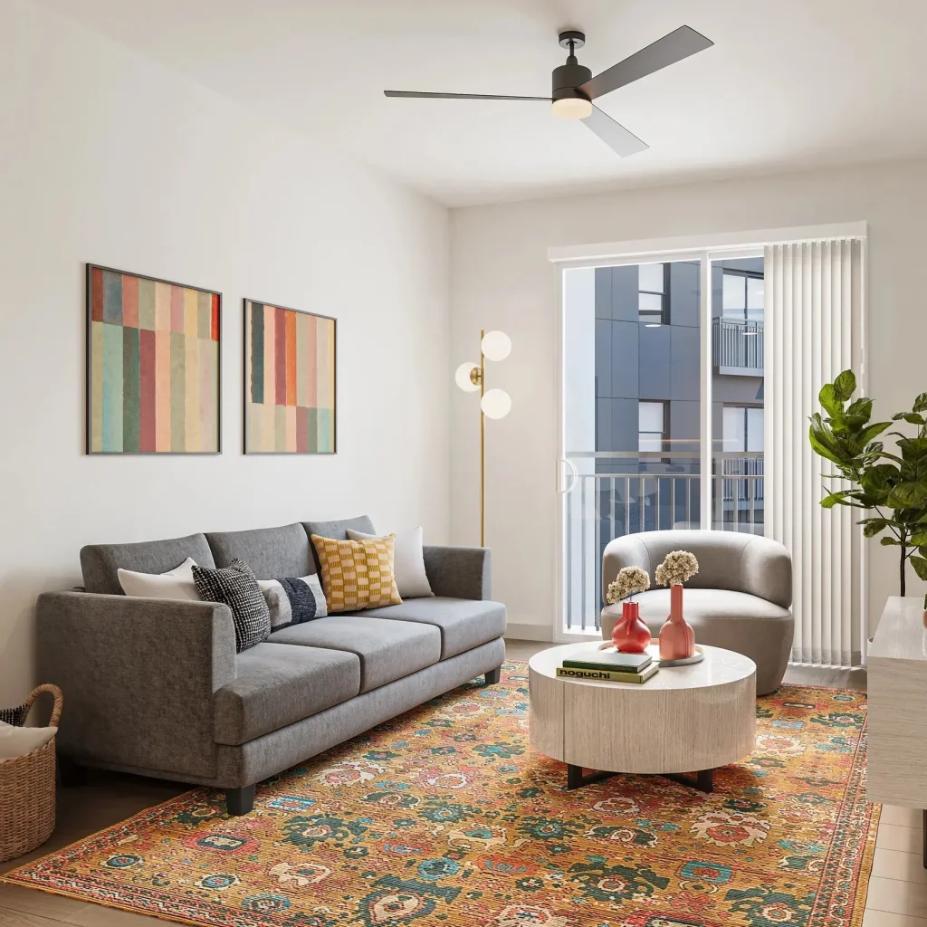 Modern student living room with hardwood-style flooring and included TV at Signature at Varsity.