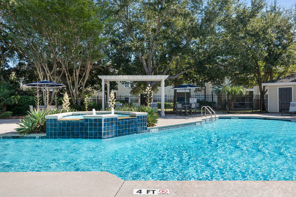 a large swimming pool with a jacuzzi and some trees at Sweetgrass Landing, Mount Pleasant, 29466