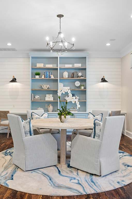 a dining room with a table and chairs and a tv at Sweetgrass Landing, Mount Pleasant, South Carolina