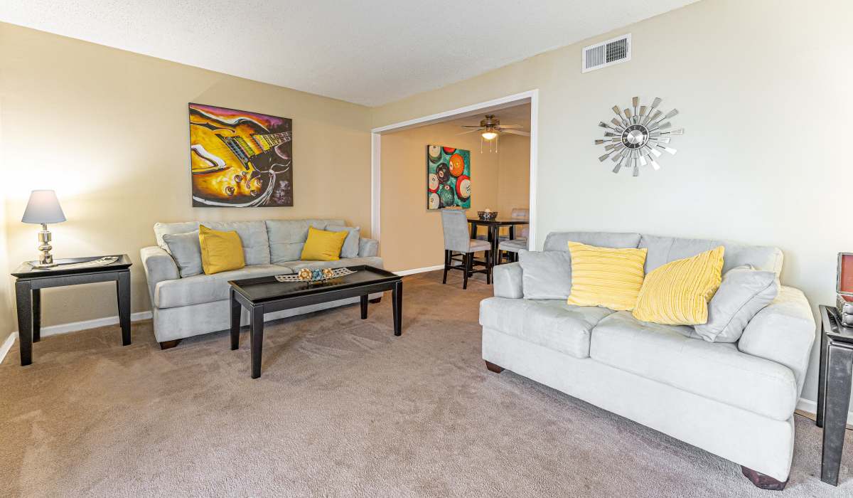 Living room with carpet flooring at Tiger Village in Columbia, Missouri