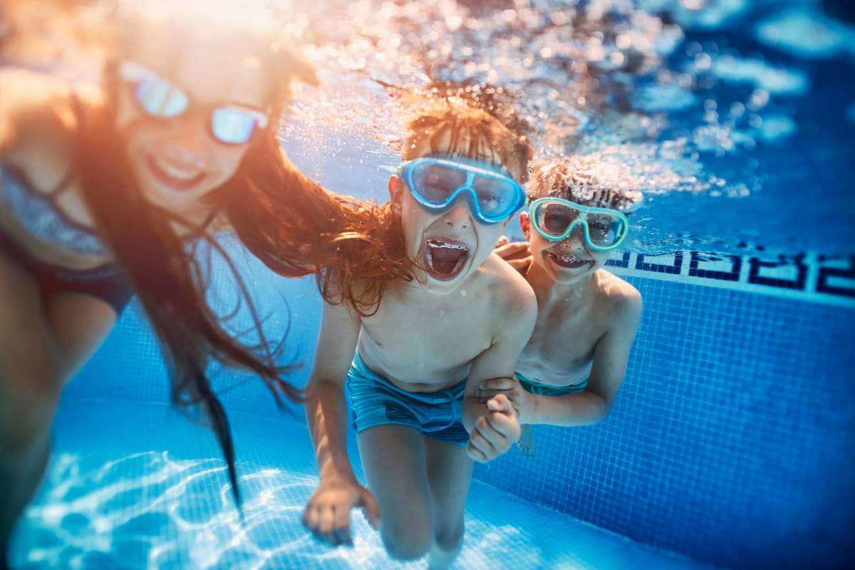 Resident kids playing in the pool at Caroline in Charleston, South Carolina