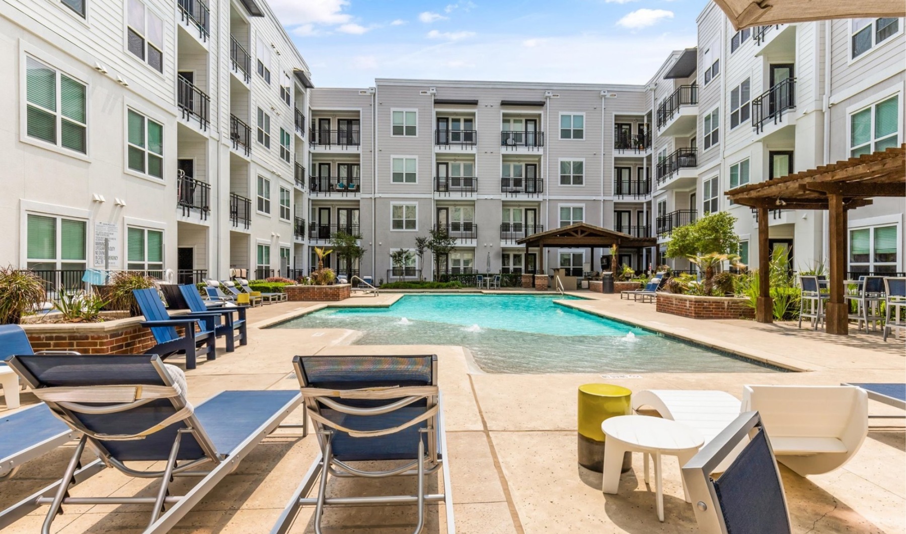 pool with modern stonework and reclining seats