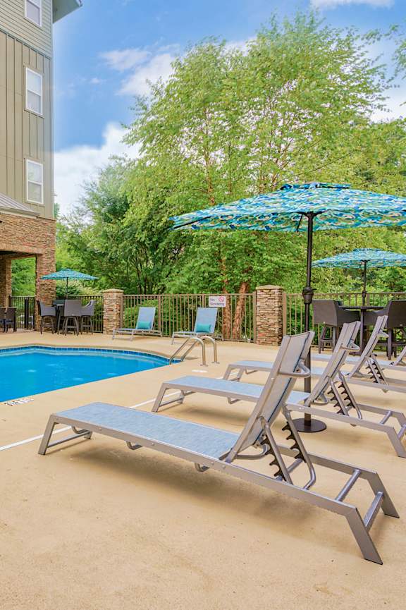 the swimming pool at the residence at dusk at The Lofts at Reynolds Village Apartments, Asheville