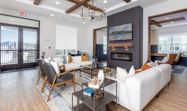 room with couch chairs and fireplace