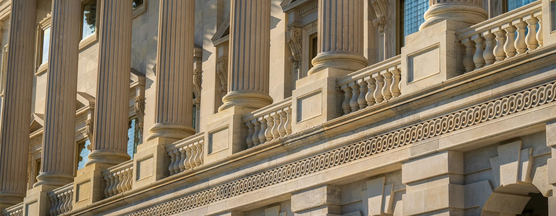 a large building with ornate designs and pillars