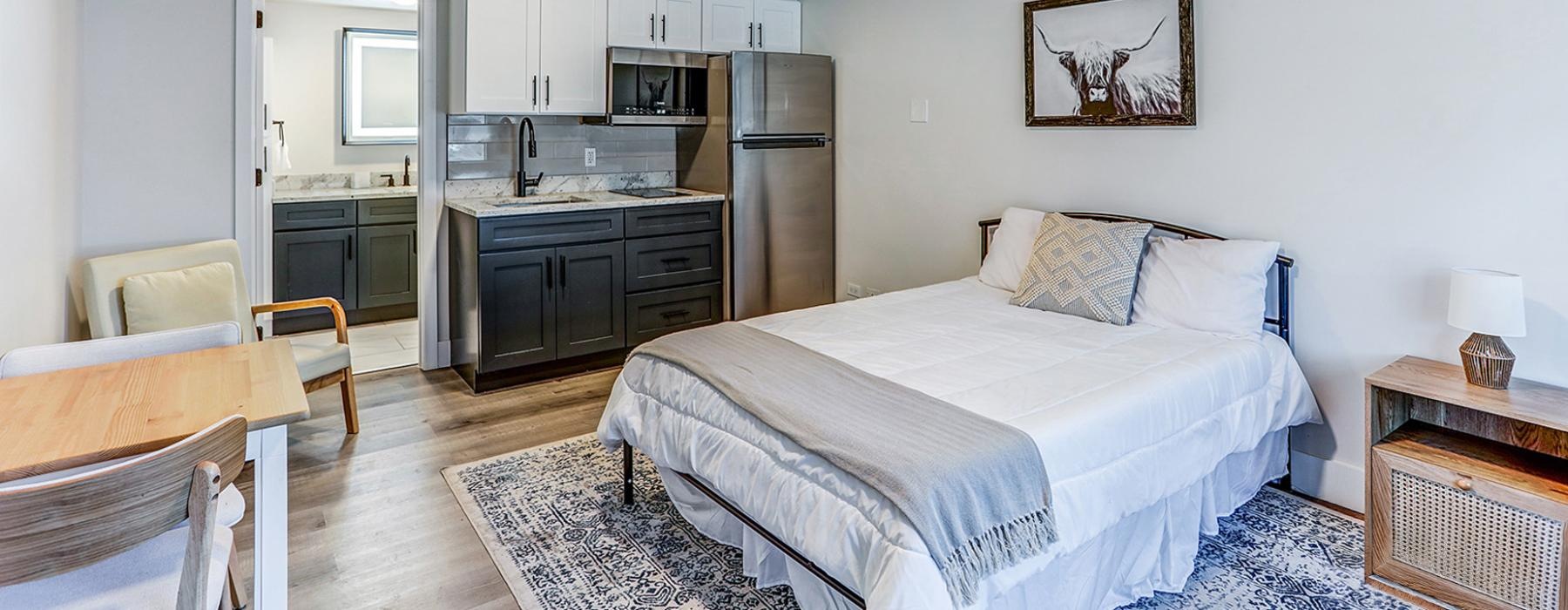 Sleeping area inside a Dalton Station studio apartment, showcasing an efficient open layout and modern interior finishes.