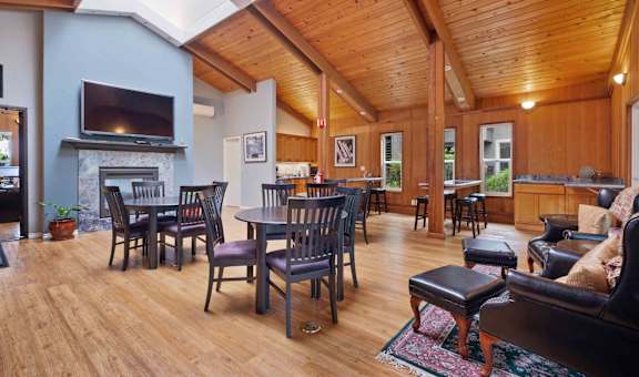 Santa Clara, CA Apartments For Rent - Hidden Lake - Clubhouse With Plenty Of Seating, Tables, TV, Fireplace, Hardwood Floors, And Kitchen