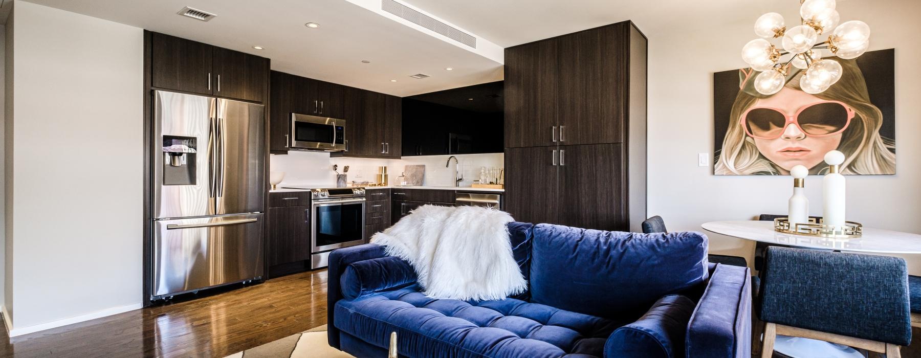 a living room with a blue couch