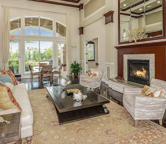 A living room with a fireplace and a couch.