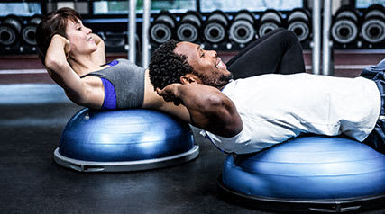 Two residents working out at the Preserve at Longleaf's fitness center